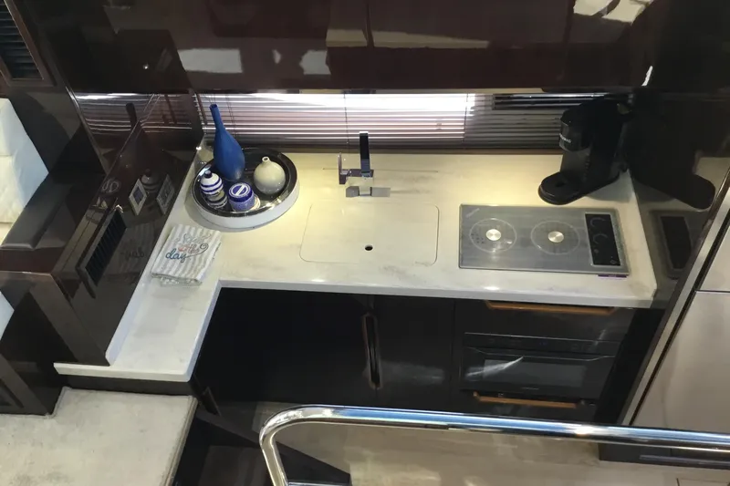 Keep Paddlin Yacht Photos Pics Modern kitchen in 2019 Galeon 430 HTC yacht with sleek countertops and appliances.