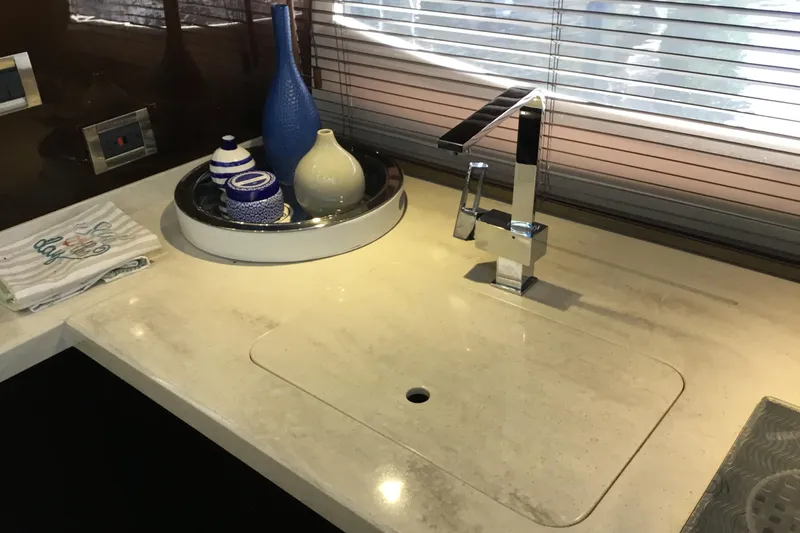 Keep Paddlin Yacht Photos Pics Modern kitchen sink area on 2019 Galeon 430 HTC yacht with decorative vases.