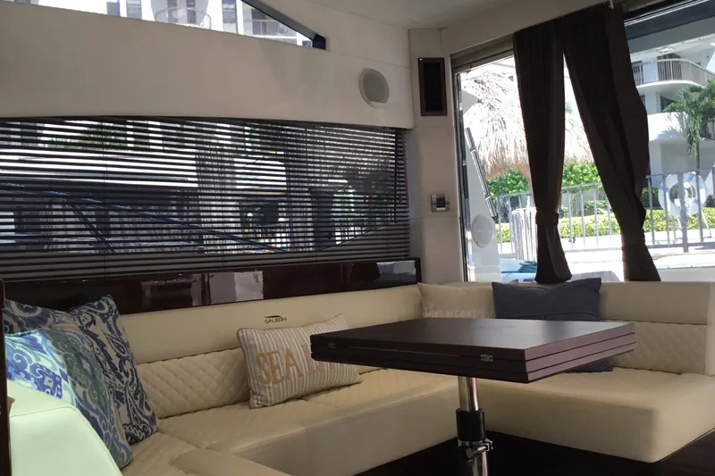 Keep Paddlin Yacht Photos Pics Luxurious interior of 2019 Galeon 430 HTC yacht with elegant seating and table.