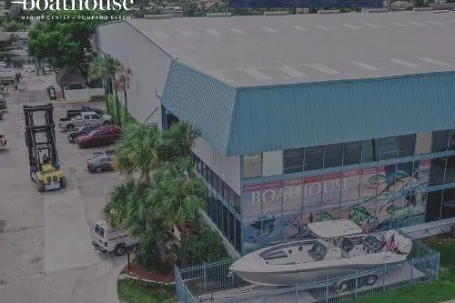 Keep Paddlin Yacht Photos Pics Aerial view of 2019 Galeon 430 HTC yacht outside a large boathouse facility.