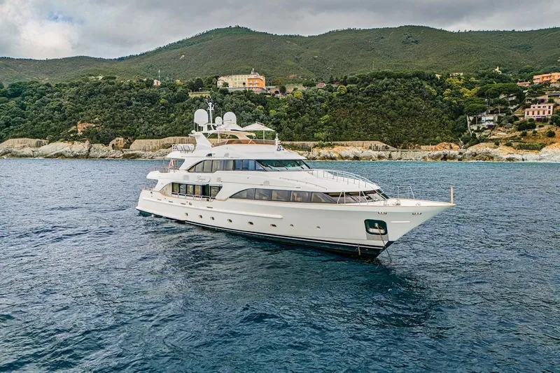 Giorgia I Yacht Photos Pics Luxury Benetti Classic 120 yacht from 2009 cruising near scenic coastline.