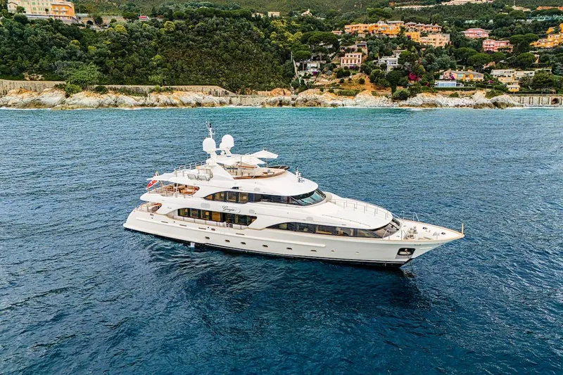Giorgia I Yacht Photos Pics Luxury Benetti Classic 120 yacht cruising near scenic coastline, 2009 model.