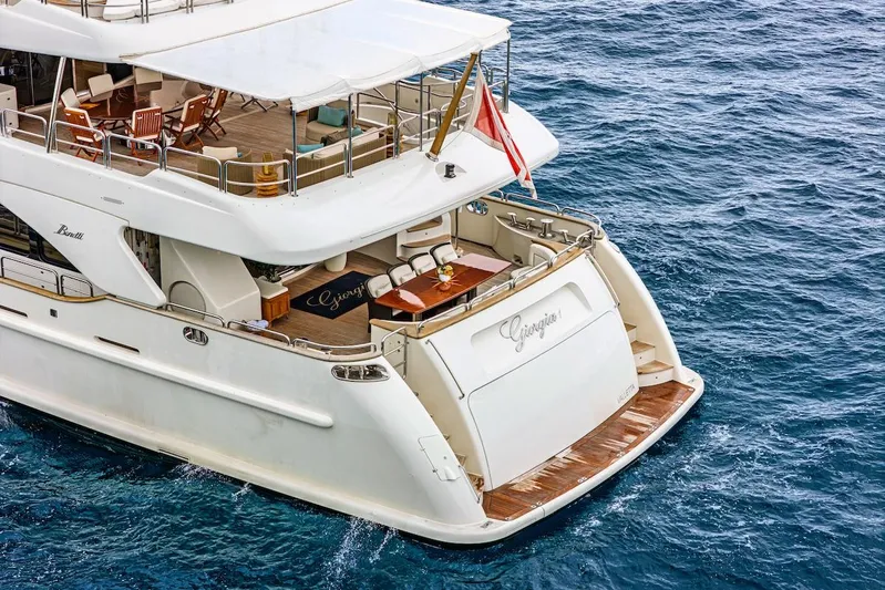 Giorgia I Yacht Photos Pics Luxury Benetti Classic 120 yacht from 2009 on open sea, featuring elegant deck design.