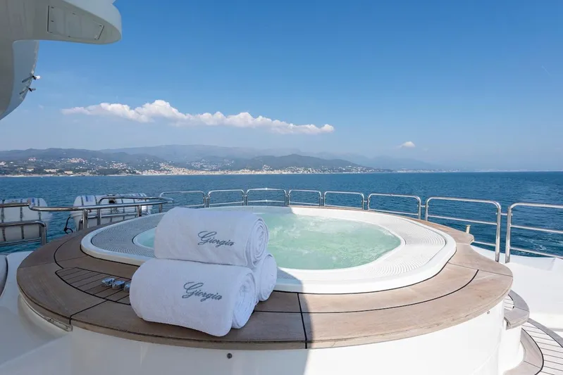 Giorgia I Yacht Photos Pics Luxurious jacuzzi on Benetti Classic 120 yacht, 2009, with ocean view and towels.