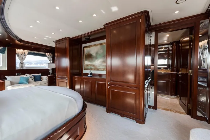 Giorgia I Yacht Photos Pics Luxurious bedroom interior on 2009 Benetti Classic 120 yacht with elegant wood paneling.
