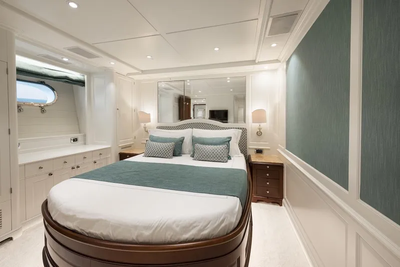 Giorgia I Yacht Photos Pics Luxurious bedroom interior on 2009 Benetti Classic 120 yacht, featuring elegant decor and plush bedding.