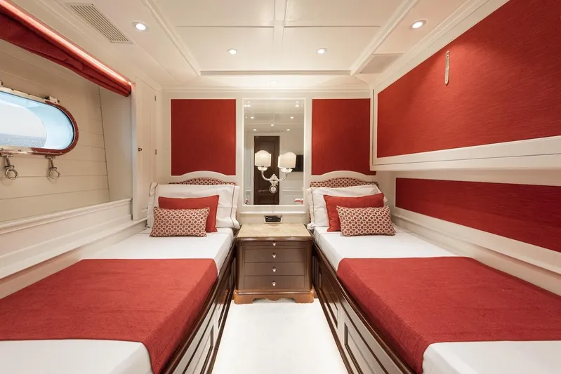 Giorgia I Yacht Photos Pics Luxurious twin cabin with red accents on a 2009 Benetti Classic 120 yacht.