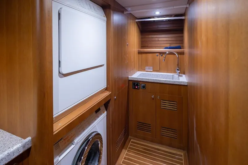 Raindancer Yacht Photos Pics Laundry area in 2009 Selene 60 Ocean Trawler with washer, dryer, and sink.