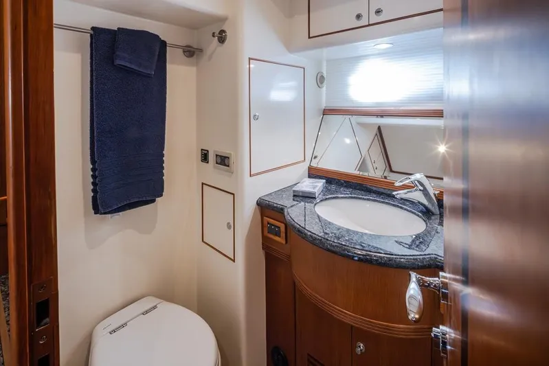 Raindancer Yacht Photos Pics Luxurious bathroom in 2009 Selene 60 Ocean Trawler with elegant fixtures and granite countertop.