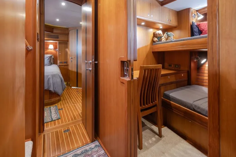 Raindancer Yacht Photos Pics Luxurious 2009 Selene 60 Ocean Trawler interior with cozy wooden cabin and bunk beds.
