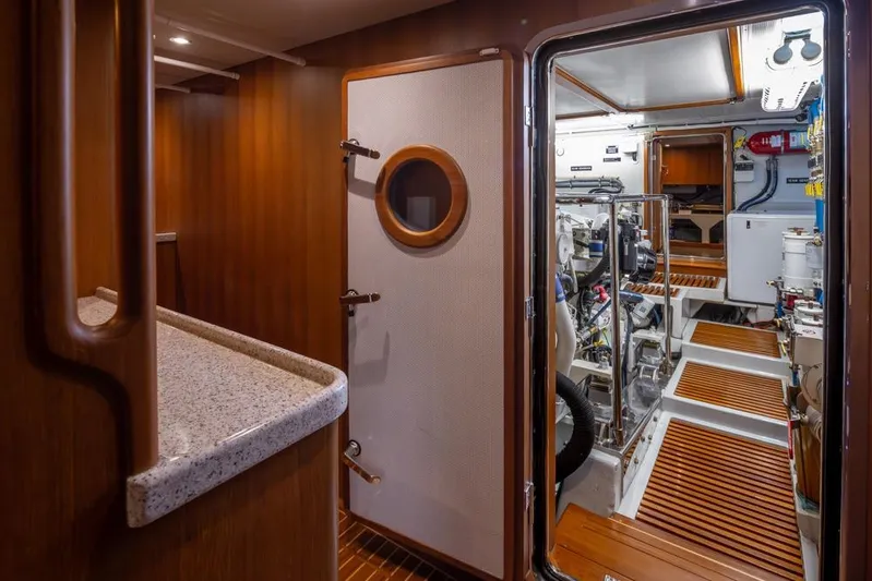 Raindancer Yacht Photos Pics Engine room of 2009 Selene 60 Ocean Trawler with wooden and metallic finishes.