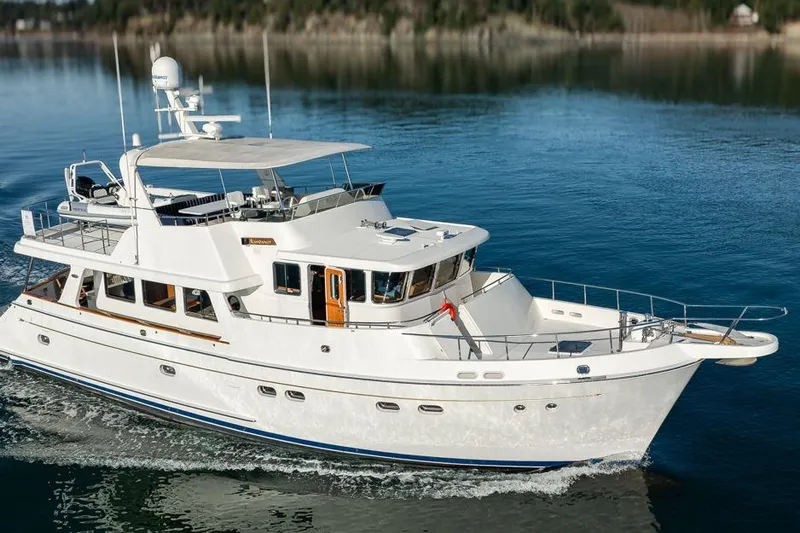 Raindancer Yacht Photos Pics 2009 Selene 60 Ocean Trawler cruising on calm waters, showcasing elegant design and luxury.