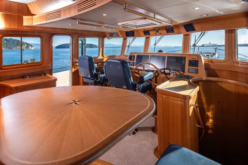 Raindancer Yacht Photos Pics Luxurious 2009 Selene 60 Ocean Trawler interior with wooden finishes and panoramic ocean views.