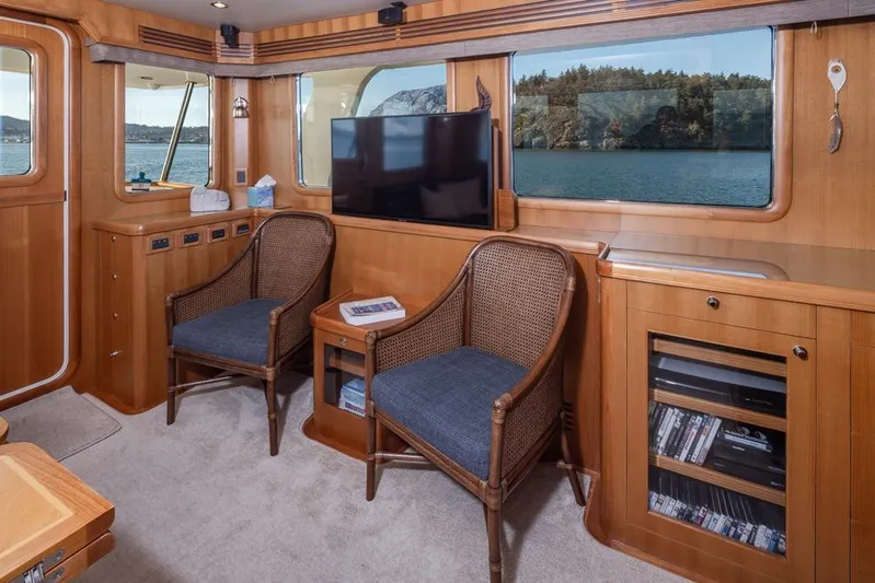 Raindancer Yacht Photos Pics Interior of 2009 Selene 60 Ocean Trawler with wooden decor and scenic window view.