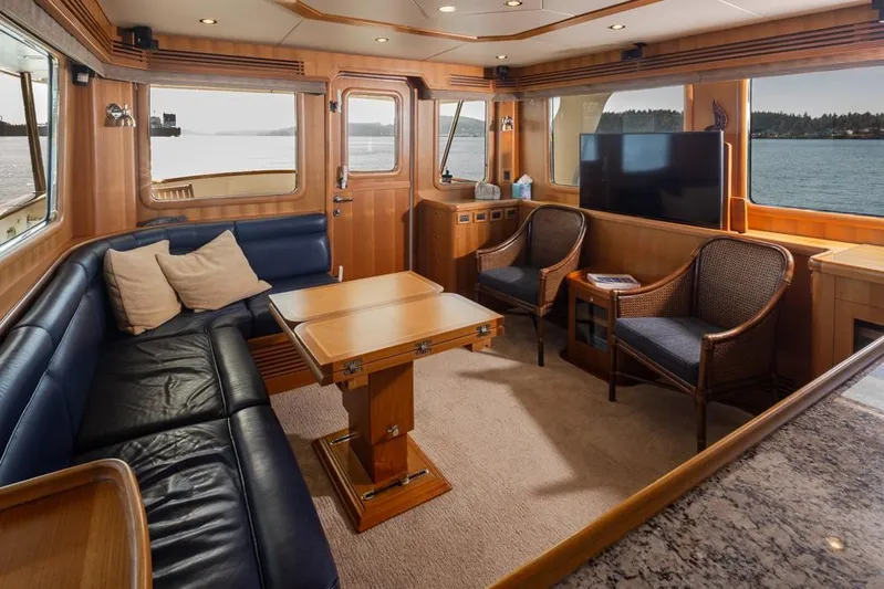 Raindancer Yacht Photos Pics Luxurious interior of 2009 Selene 60 Ocean Trawler with elegant seating and scenic views.