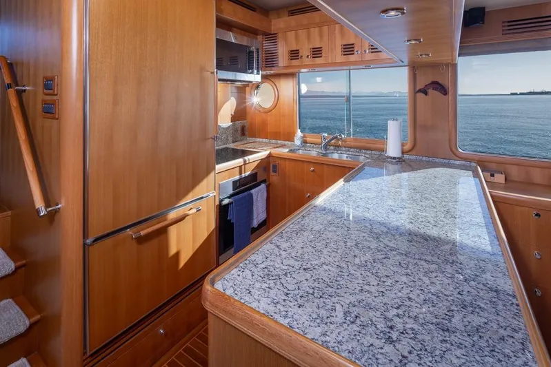 Raindancer Yacht Photos Pics Luxurious 2009 Selene 60 Ocean Trawler kitchen with granite countertops and ocean view.