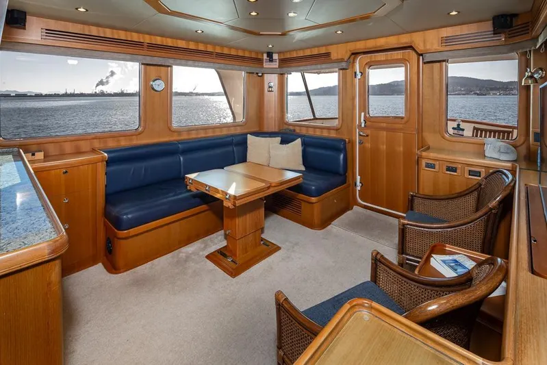 Raindancer Yacht Photos Pics Luxurious interior of 2009 Selene 60 Ocean Trawler with ocean view and elegant wood finish.