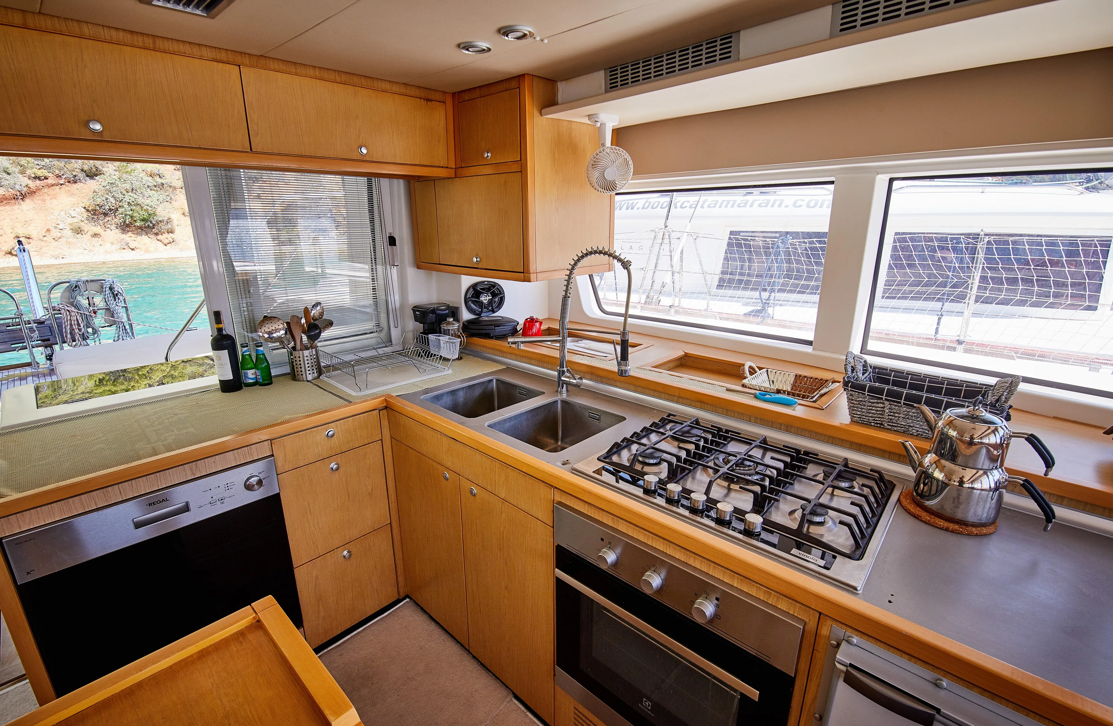  Yacht Photos Pics Modern kitchen interior on 2014 Lagoon 52 F yacht with stove and sink.