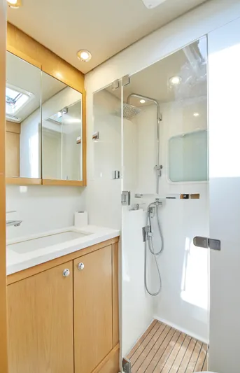  Yacht Photos Pics Modern bathroom in 2014 Lagoon 52 F yacht with shower and wooden cabinetry.