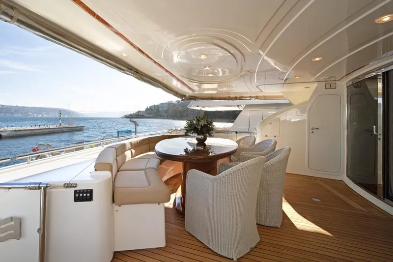 Yacht Photos Pics Luxurious 1999 Ferretti Customline 94 yacht deck with elegant seating and ocean view.