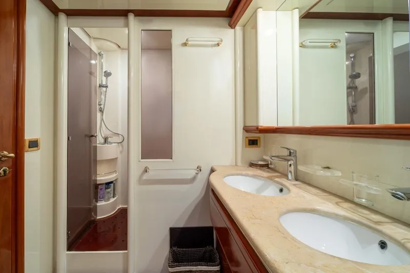 Yacht Photos Pics Luxurious bathroom in 1999 Ferretti Customline 94 yacht with double sinks and shower.