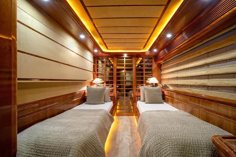  Yacht Photos Pics Luxurious twin cabin interior on 1999 Ferretti Customline 94 yacht, featuring elegant wood paneling.