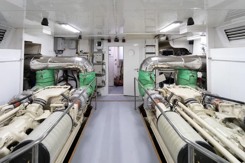  Yacht Photos Pics Engine room of 1999 Ferretti Customline 94 yacht, featuring dual engines and ventilation systems.