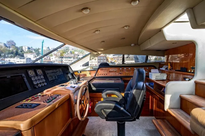  Yacht Photos Pics Luxurious 1999 Ferretti Customline 94 yacht cockpit with modern controls and panoramic view.