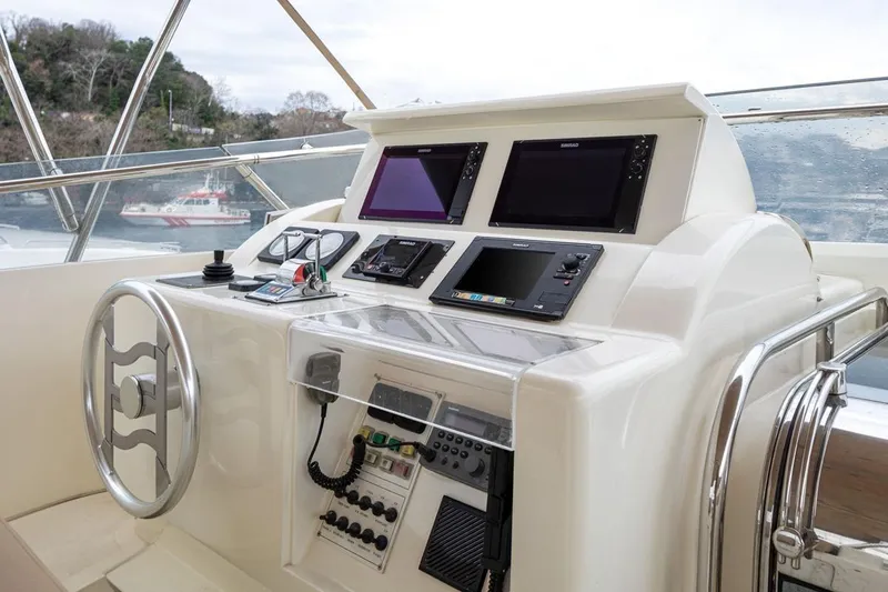  Yacht Photos Pics Helm of 1999 Ferretti Yachts CUSTOMLINE 94 with modern navigation equipment.