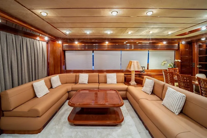  Yacht Photos Pics Luxurious interior of 1999 Ferretti Yachts CUSTOMLINE 94 with elegant seating and wooden accents.