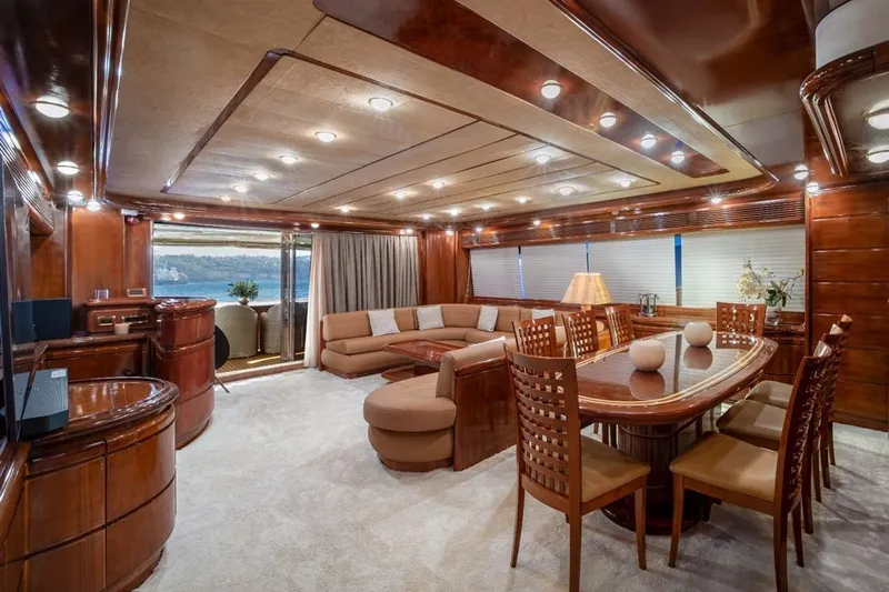  Yacht Photos Pics Luxurious interior of 1999 Ferretti Yachts CUSTOMLINE 94 with elegant wood finishes and spacious seating.