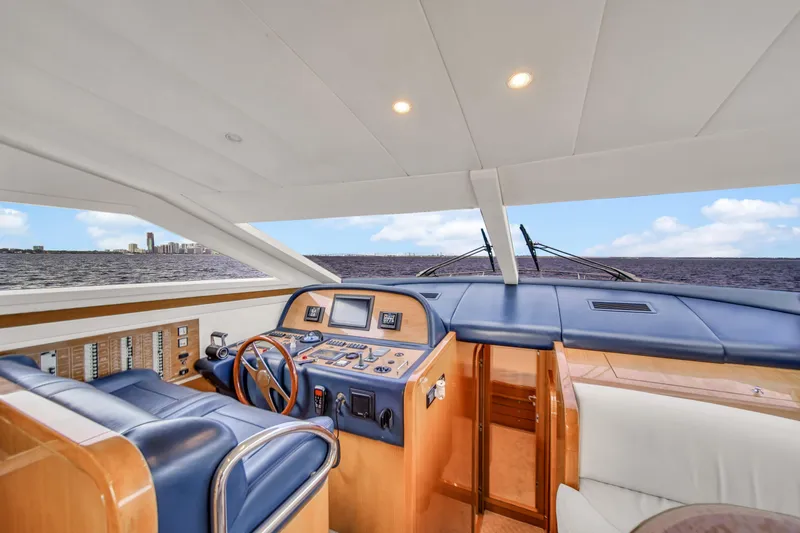  Yacht Photos Pics Interior helm of 2006 Uniesse 58 yacht with modern navigation equipment.