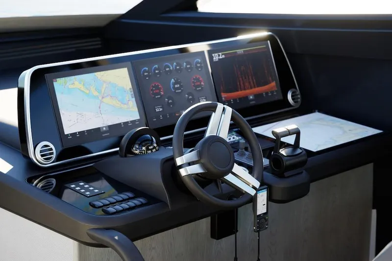  Yacht Photos Pics Modern yacht cockpit with advanced navigation displays, steering wheel, and controls, Pearl 73, 2027 model.