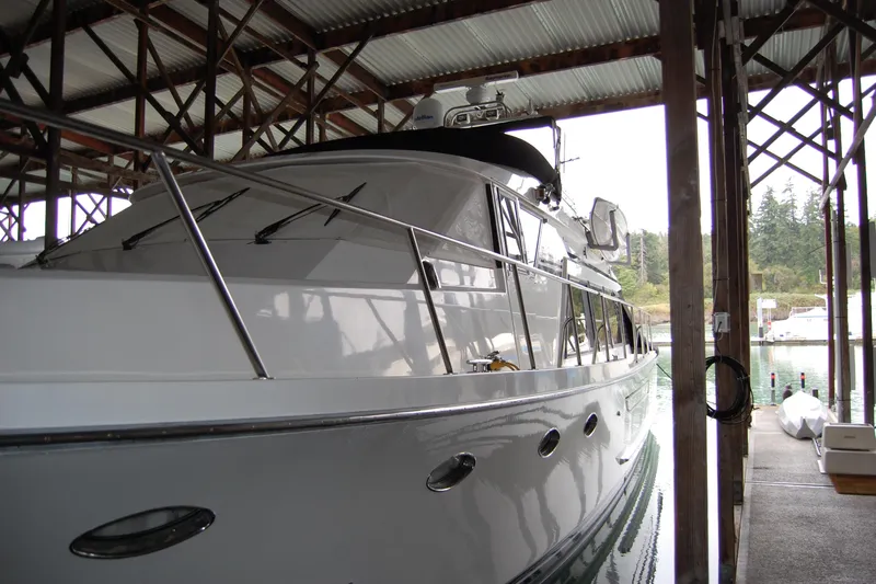Sumptin Special Yacht Photos Pics 1990 Ocean Alexander 520 Pilothouse yacht docked in a covered marina.