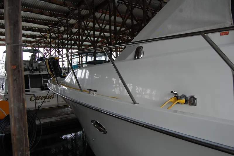 Sumptin Special Yacht Photos Pics 1990 Ocean Alexander 520 Pilothouse yacht docked in a covered marina.