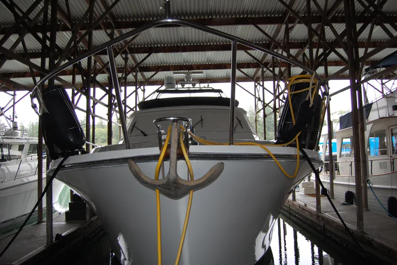 Sumptin Special Yacht Photos Pics 1990 Ocean Alexander 520 Pilothouse yacht docked in a covered marina.