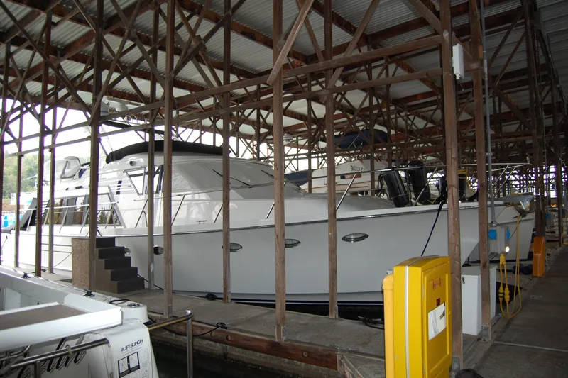 Sumptin Special Yacht Photos Pics 1990 Ocean Alexander 520 Pilothouse yacht docked in a covered marina.