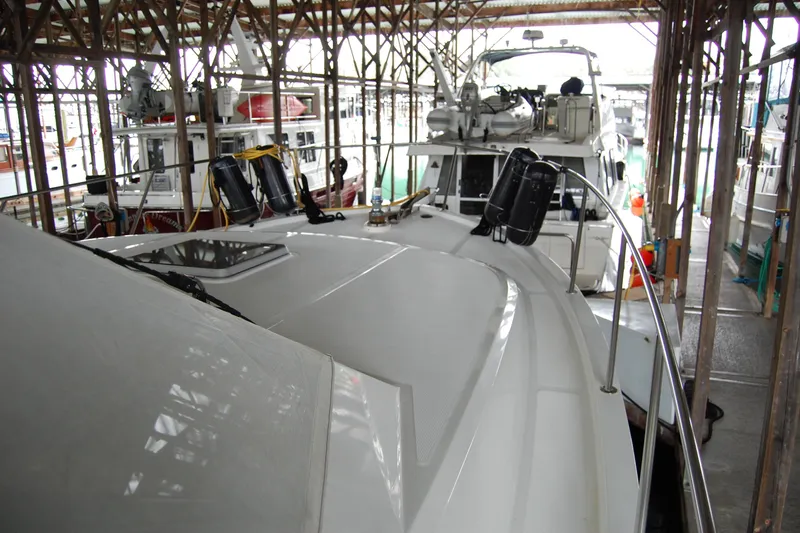 Sumptin Special Yacht Photos Pics Ocean Alexander 520 Pilothouse yacht docked in a marina, 1990 model.