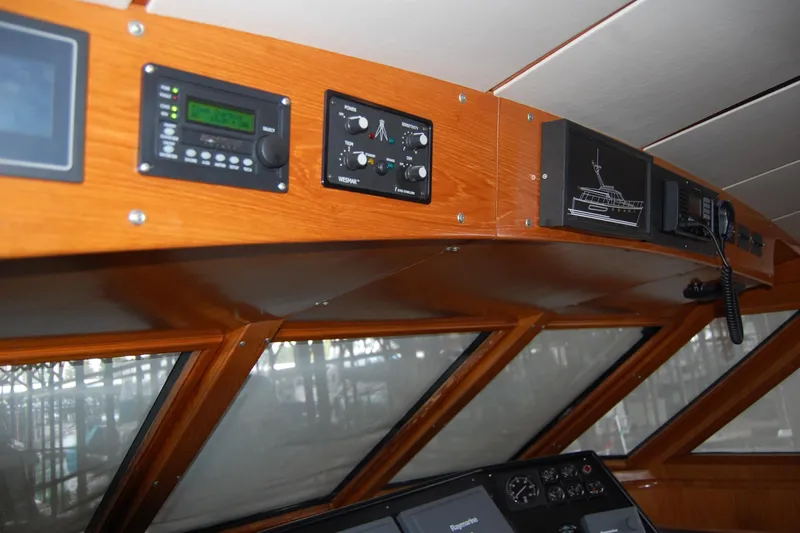 Sumptin Special Yacht Photos Pics Interior view of 1990 Ocean Alexander 520 Pilothouse with navigation instruments.