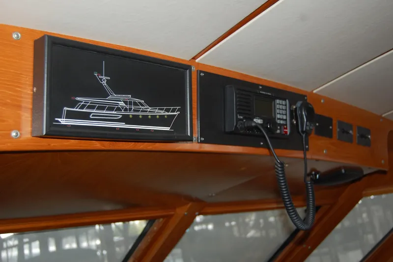 Sumptin Special Yacht Photos Pics Interior view of 1990 Ocean Alexander 520 Pilothouse with communication equipment.