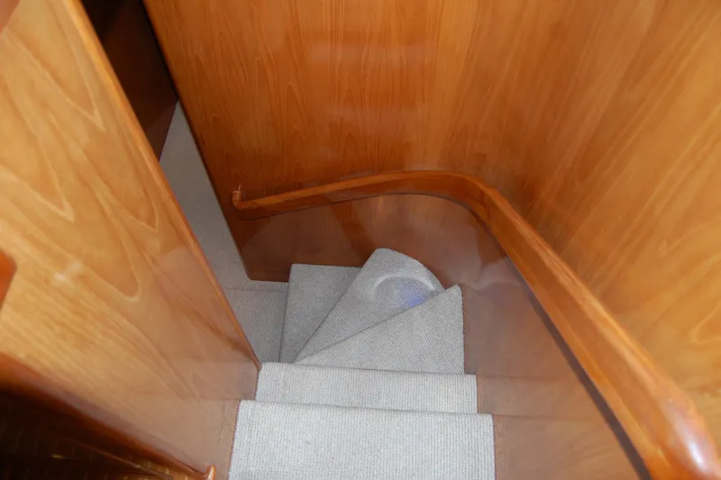 Sumptin Special Yacht Photos Pics Staircase with wooden paneling on 1990 Ocean Alexander 520 Pilothouse yacht.