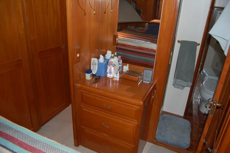 Sumptin Special Yacht Photos Pics 1990 Ocean Alexander 520 Pilothouse interior with wooden cabinetry and bathroom view.