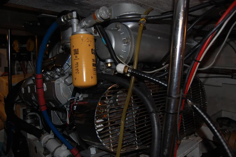 Sumptin Special Yacht Photos Pics Engine room of 1990 Ocean Alexander 520 Pilothouse with visible filter and wiring.