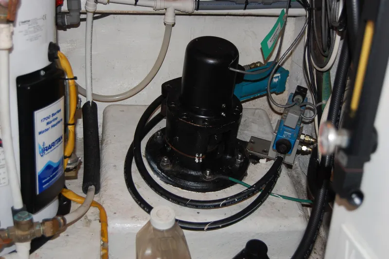 Sumptin Special Yacht Photos Pics Engine room of 1990 Ocean Alexander 520 Pilothouse with mechanical components and wiring.