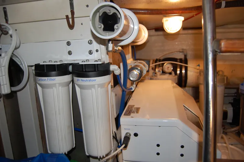 Sumptin Special Yacht Photos Pics Engine room of 1990 Ocean Alexander 520 Pilothouse with water filtration system.