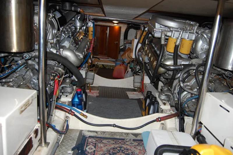 Sumptin Special Yacht Photos Pics Engine room of 1990 Ocean Alexander 520 Pilothouse with visible machinery and equipment.