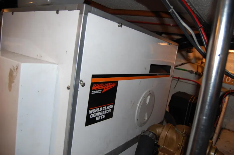 Sumptin Special Yacht Photos Pics Engine room of 1990 Ocean Alexander 520 Pilothouse with Northern Lights generator.