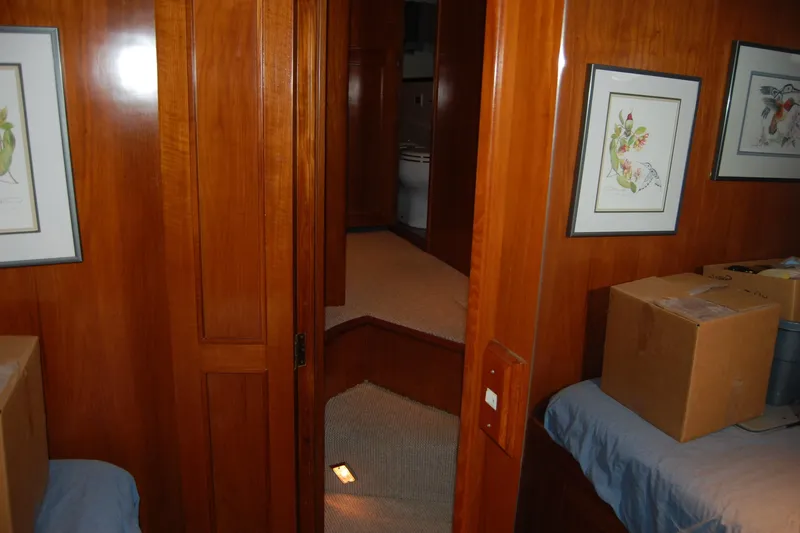 Sumptin Special Yacht Photos Pics Interior of 1990 Ocean Alexander 520 Pilothouse with wood paneling and framed artwork.
