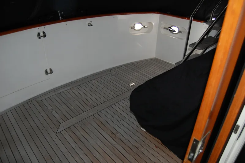 Sumptin Special Yacht Photos Pics 1990 Ocean Alexander 520 Pilothouse deck with wooden flooring and stairs.