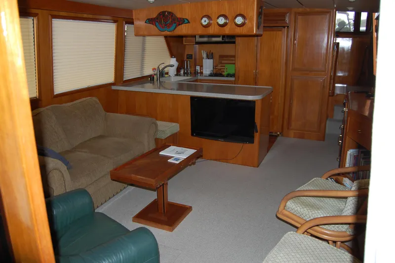 Sumptin Special Yacht Photos Pics Luxurious 1990 Ocean Alexander 520 Pilothouse interior with cozy seating and modern amenities.